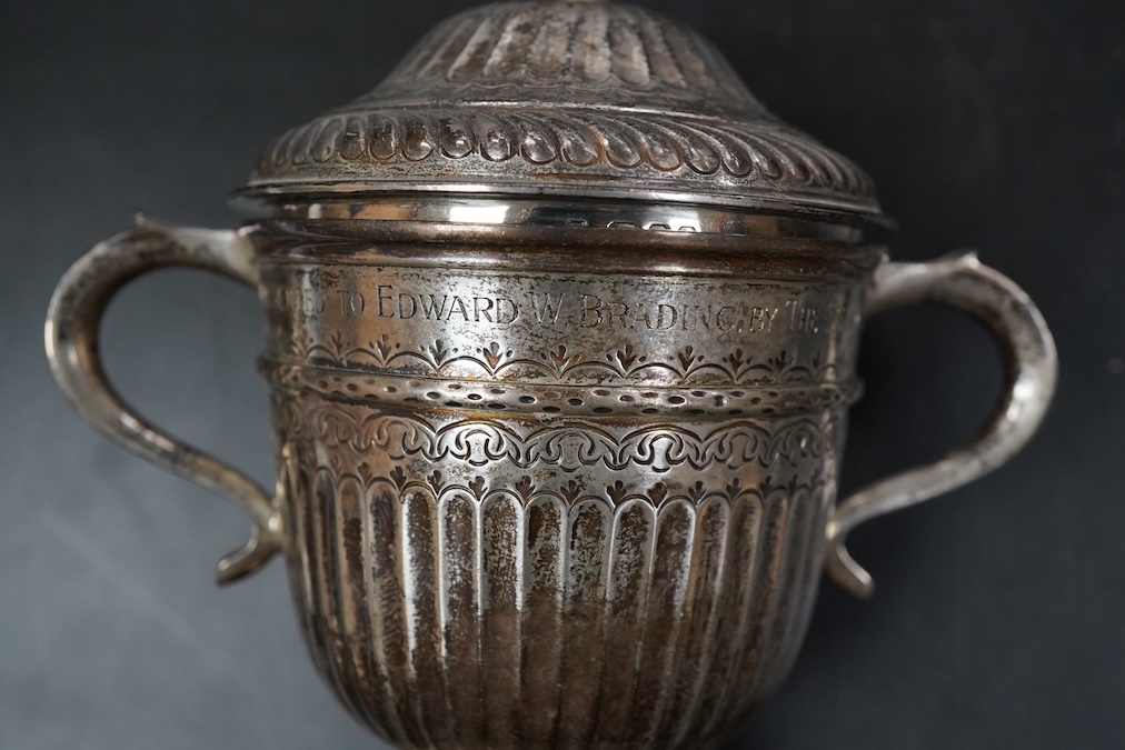 A George V silver twin handled loving cup and cover in early 18th century style height 11cm. , weight approx. 6.56ozt
